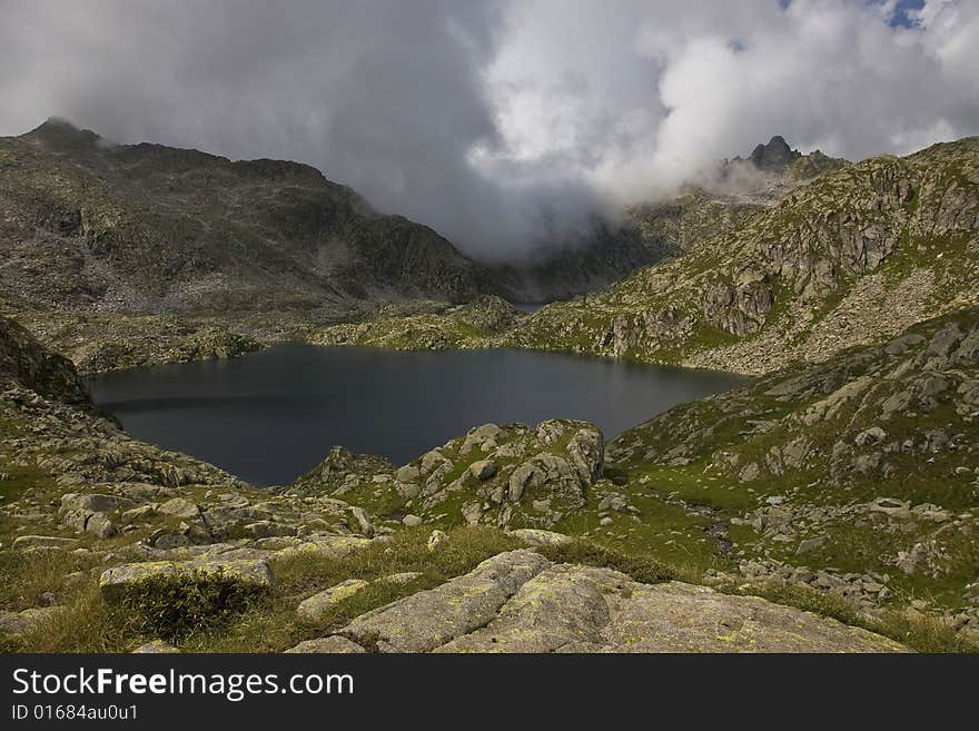 Mountains with lake and clouds