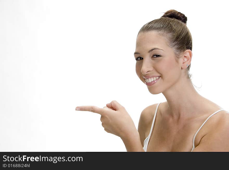 A happy young smiling woman pointing