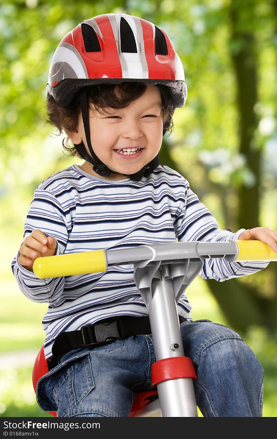 Little boy riding bicycle outdoors. Little boy riding bicycle outdoors