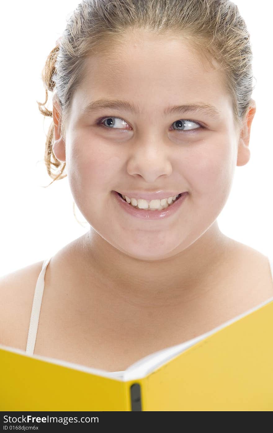 Smiling girl with book looking askance on an isolated white background