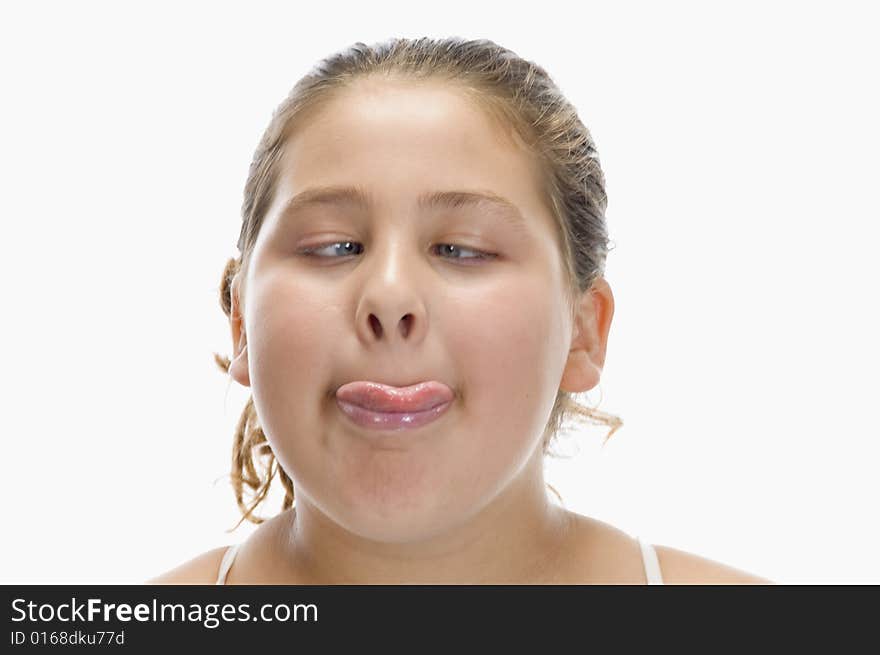 Girl keep her tongue out on an isolated white background