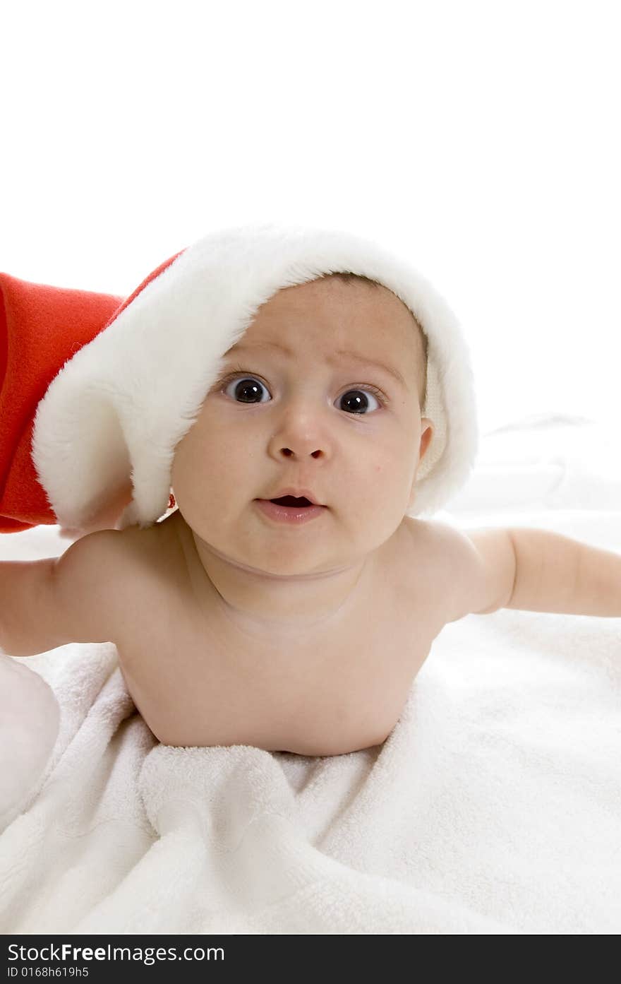 Cute baby lying with santa cap