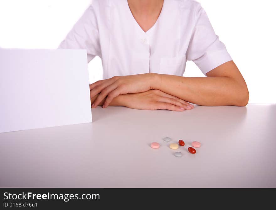 Doctor table with pills and card with copyspace