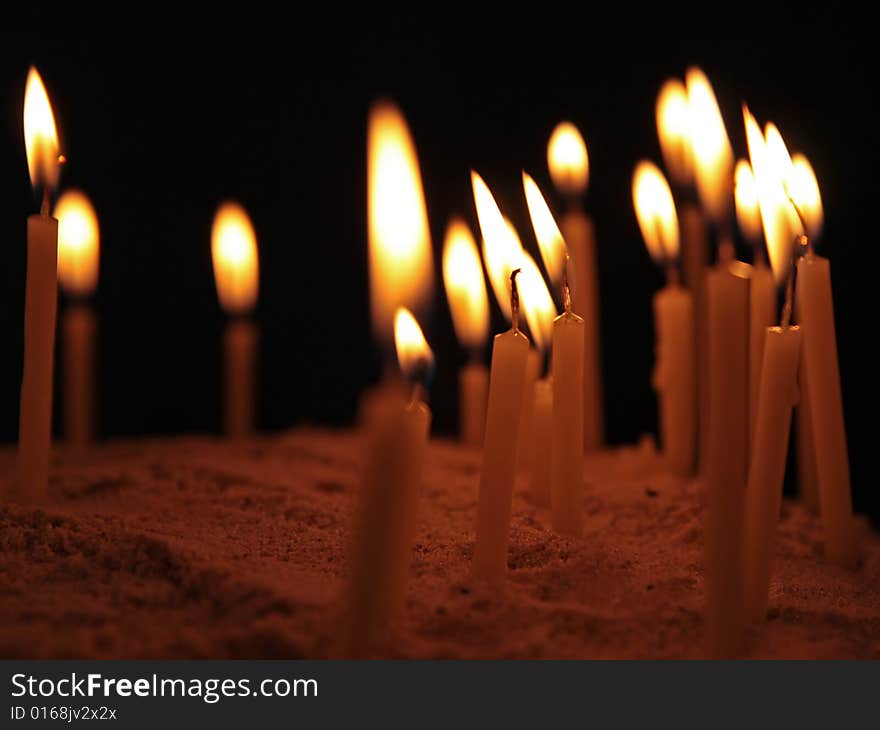 The lighted candles in an orthodox temple. The lighted candles in an orthodox temple