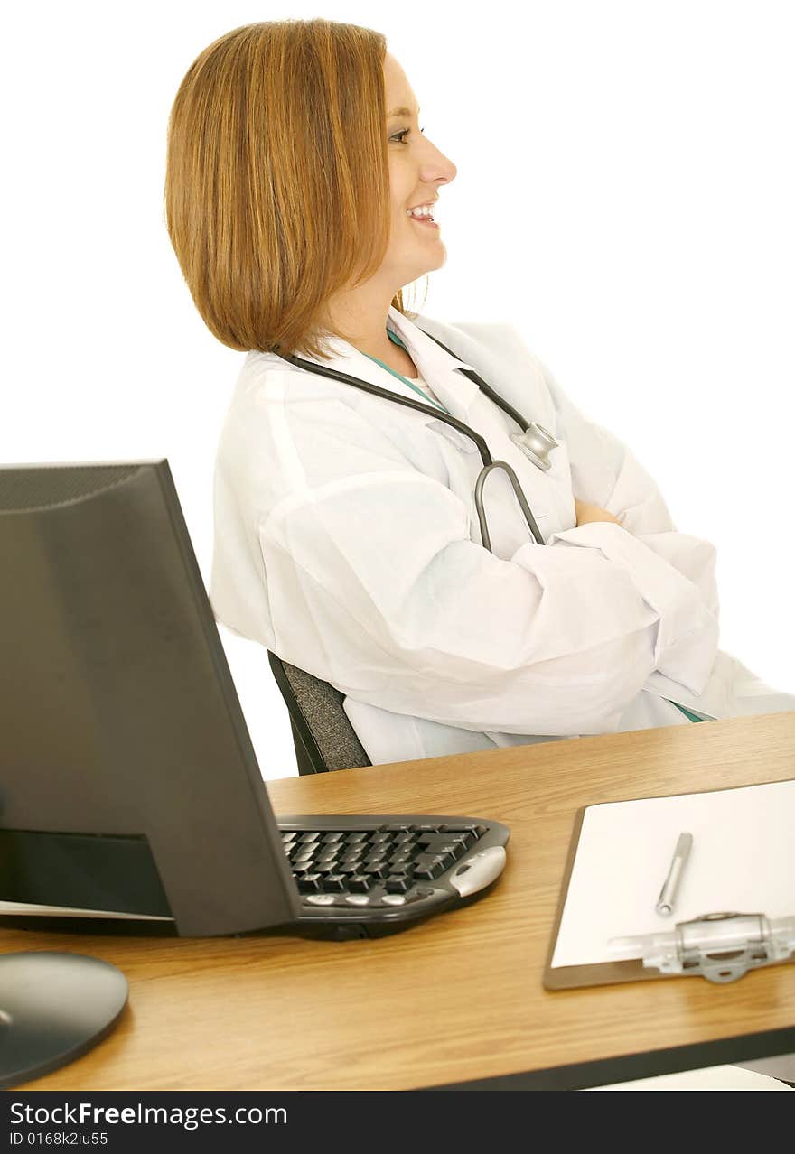 Isolated woman in doctor coat laughing and looking to her side. Isolated woman in doctor coat laughing and looking to her side