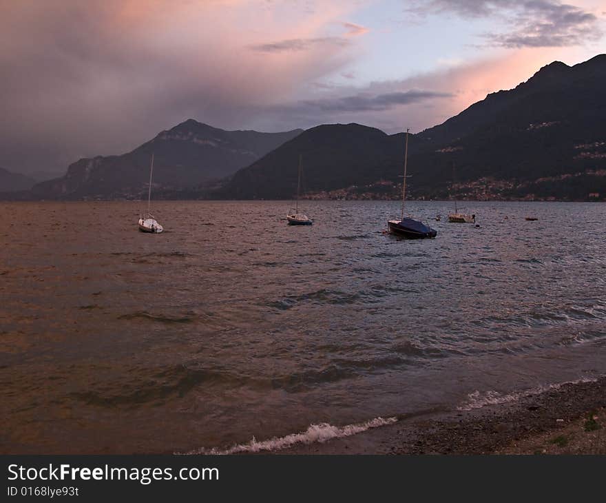 Sunset at lake with boats