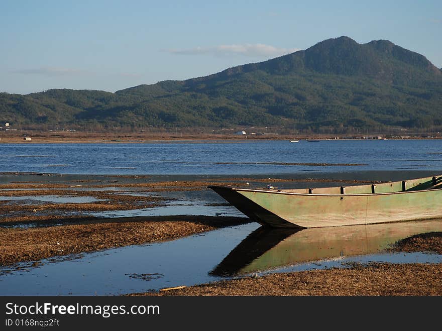 A boat at lashi lake in lijiang china. A boat at lashi lake in lijiang china