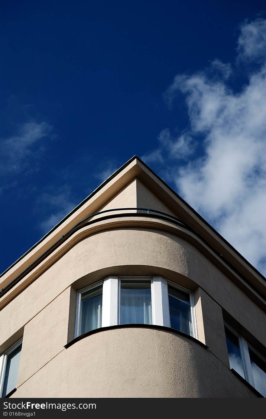 Window in rounded edge of building with very nice blue sky. Window in rounded edge of building with very nice blue sky