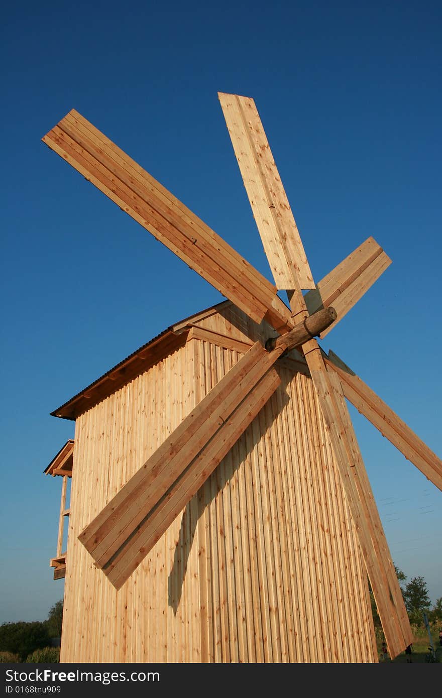 Wooden windmill against clear deep blue sky 6