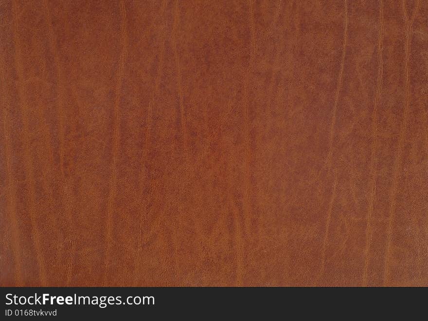 Fragment of new brown leather detailed background. Fragment of new brown leather detailed background