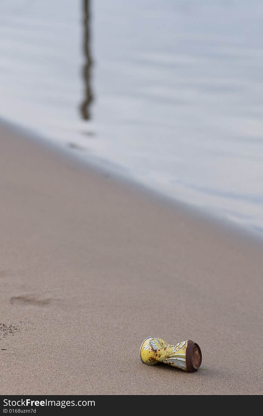 Old can on the beach