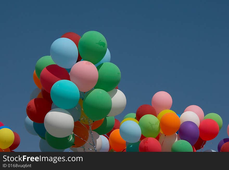 Countless colorful balloons flying in deep blue sky. Countless colorful balloons flying in deep blue sky