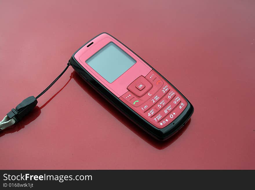 Mobile phone in close-up pink in colour