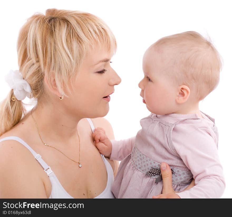 Mother hold baby girl and look at her eyes. Image isolated on white background. Mother hold baby girl and look at her eyes. Image isolated on white background