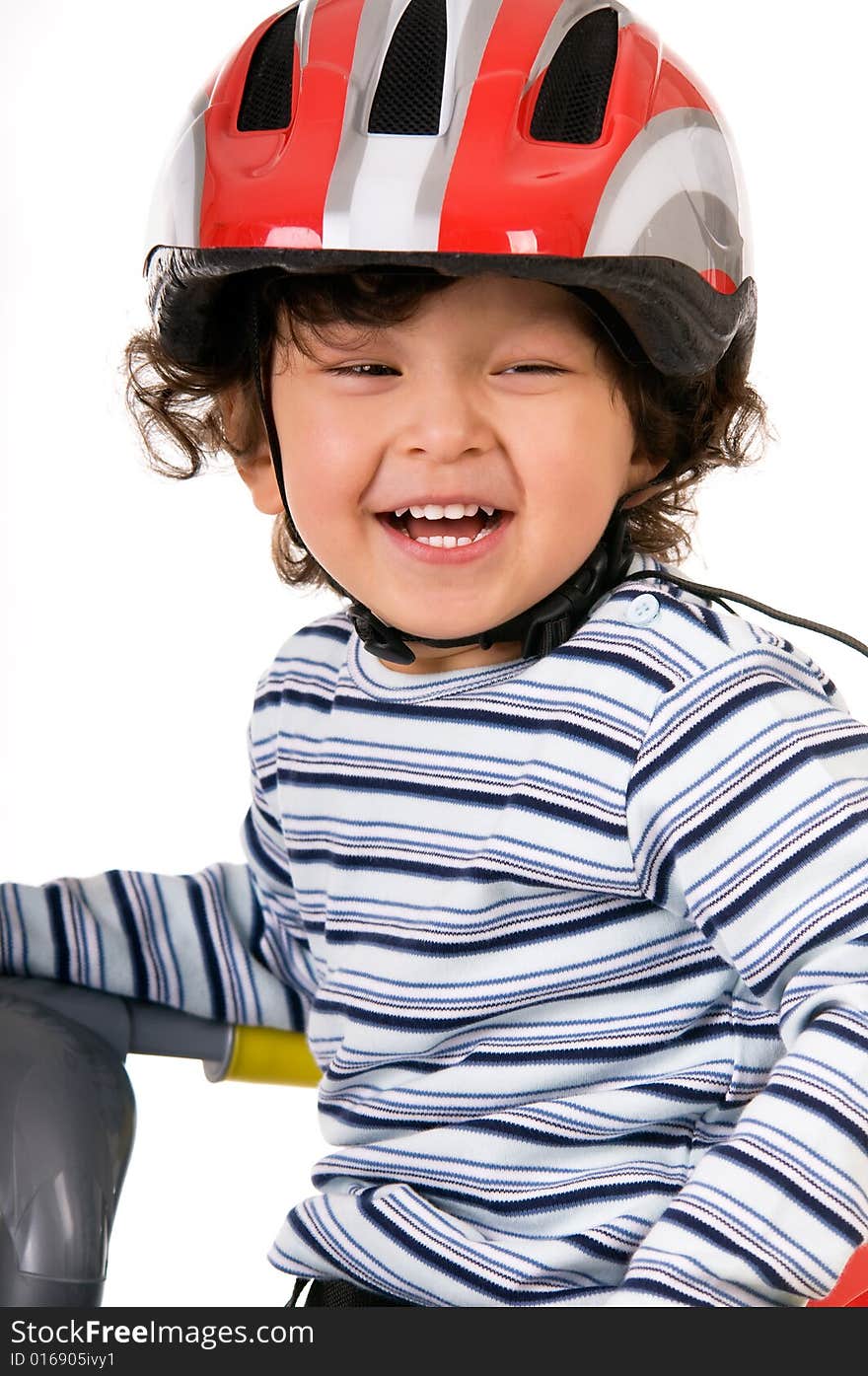 The child in a protective helmet. The child in a protective helmet