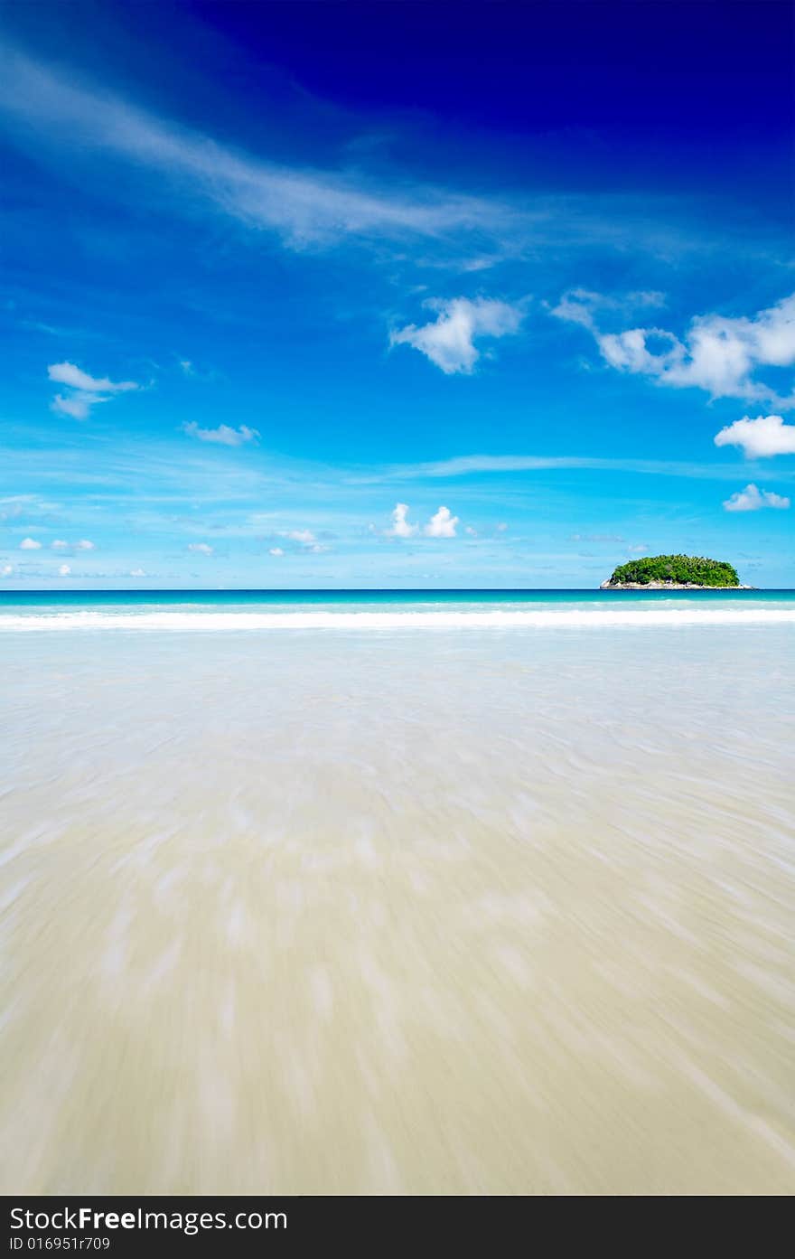 View of cerulean ocean surface and nice tropic island in the distance. View of cerulean ocean surface and nice tropic island in the distance