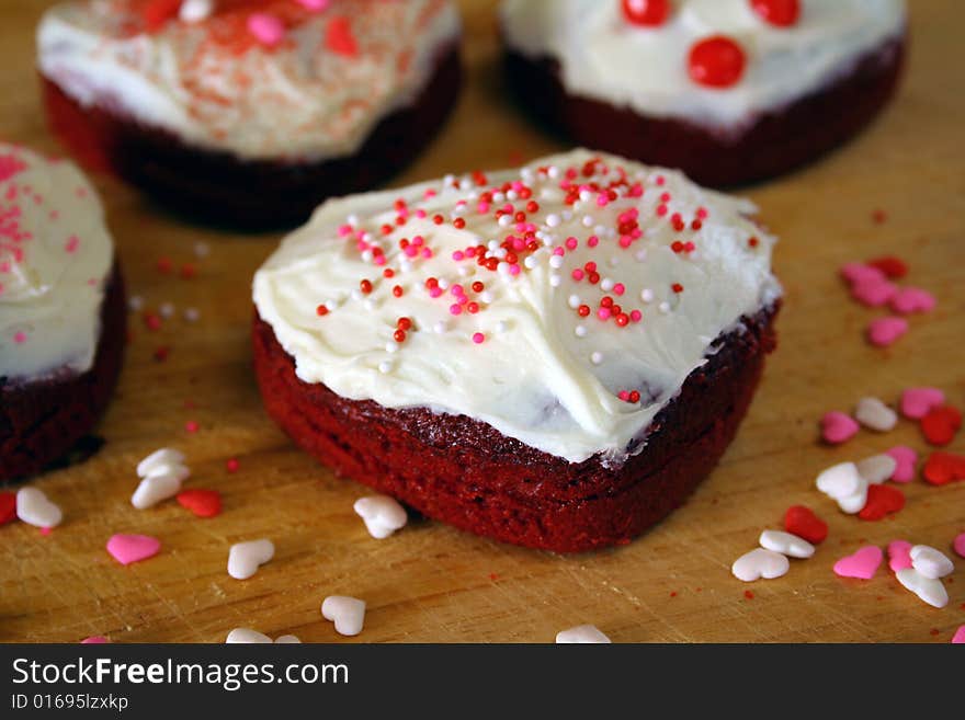 Close up of heart shaped cakes with sprinkles. Close up of heart shaped cakes with sprinkles