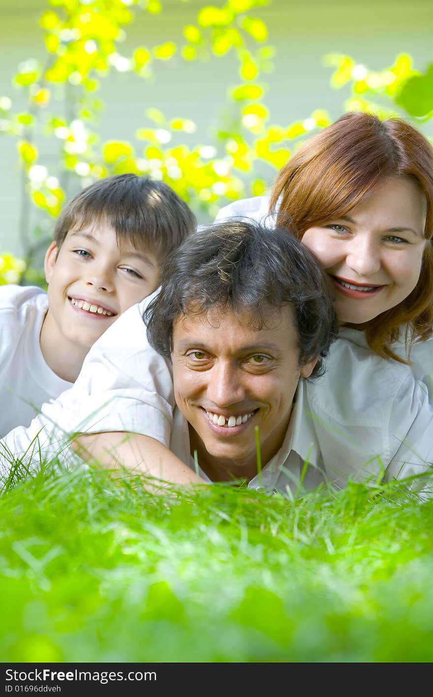 Portrait of young happy family in summer environment. Portrait of young happy family in summer environment