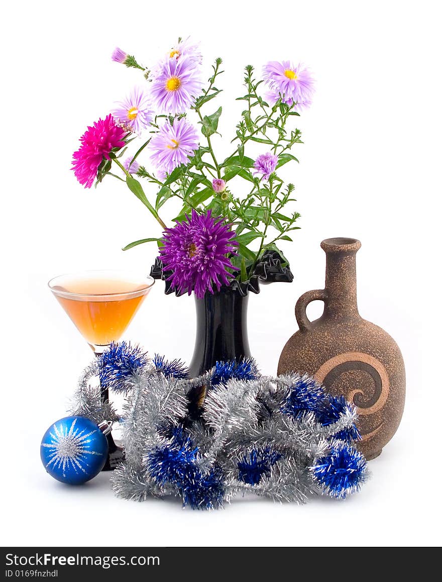 Black vase with colors and New Year's ornaments with blue spheres on white background