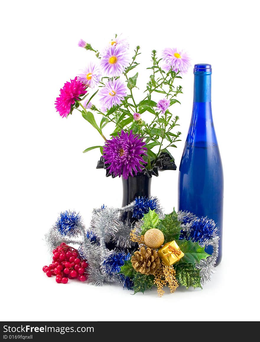 Black vase with colors and New Year's ornaments with dark-blue bottle fault on white background