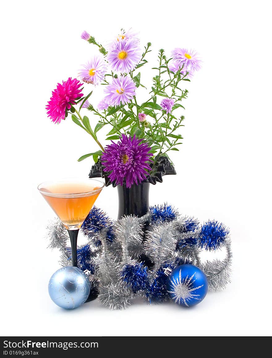 Black vase with colors and New Year's ornaments with blue spheres on white background