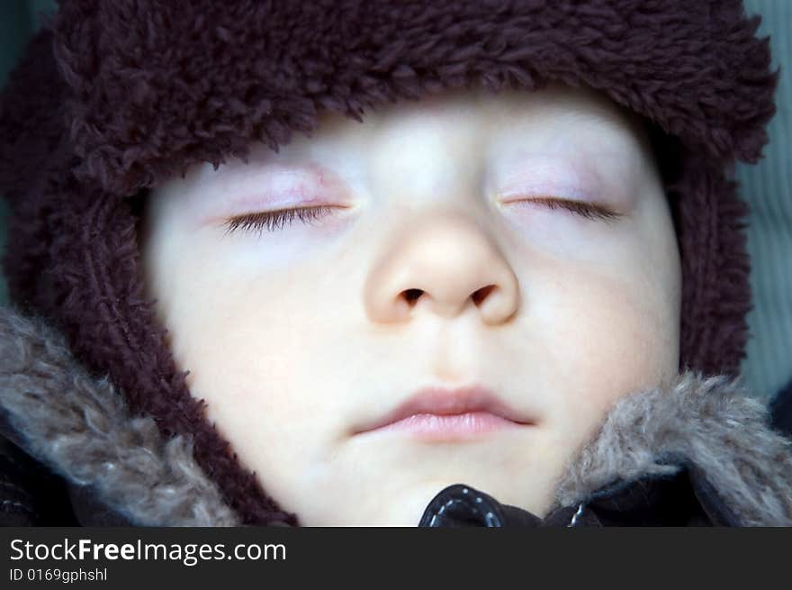 Sleeping baby boy dressed warm during winter. Sleeping baby boy dressed warm during winter