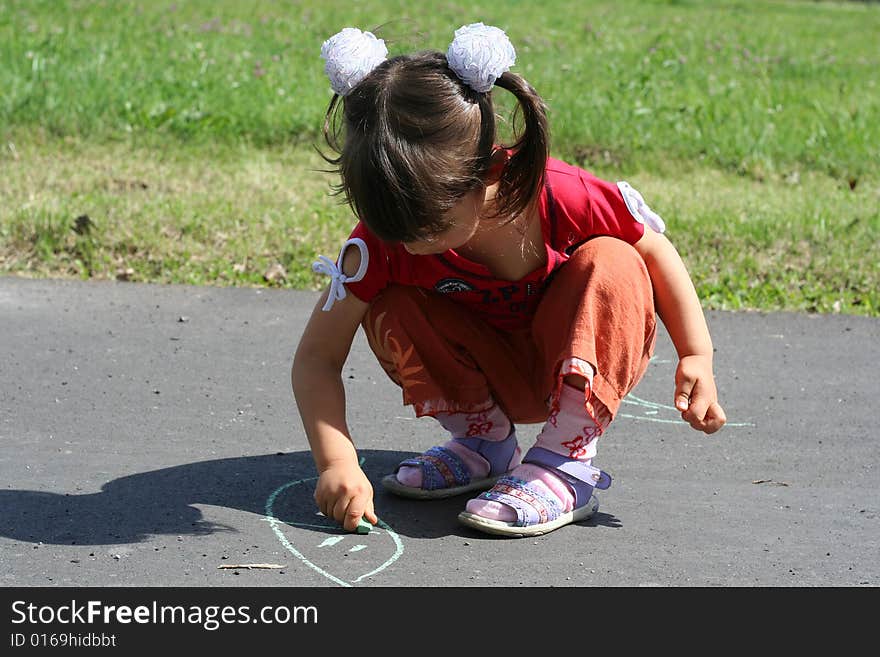 Little girl is drawing