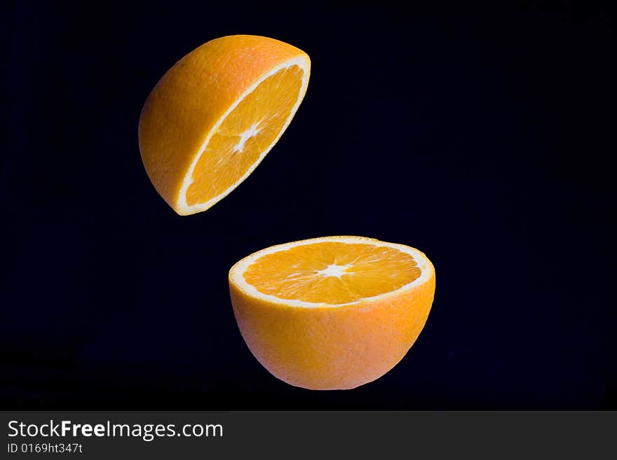 Fresh Orange Cut Into Two Pieces