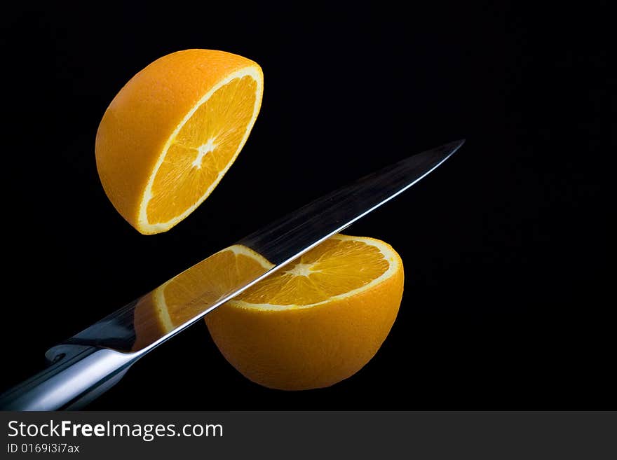 Fresh Orange Cut Into Two Pieces