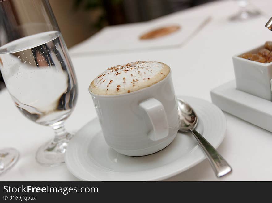 The cappuccino in a cafe in the evening