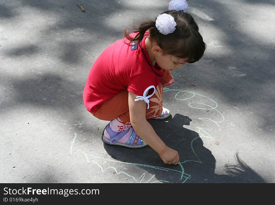 Little girl is drawing