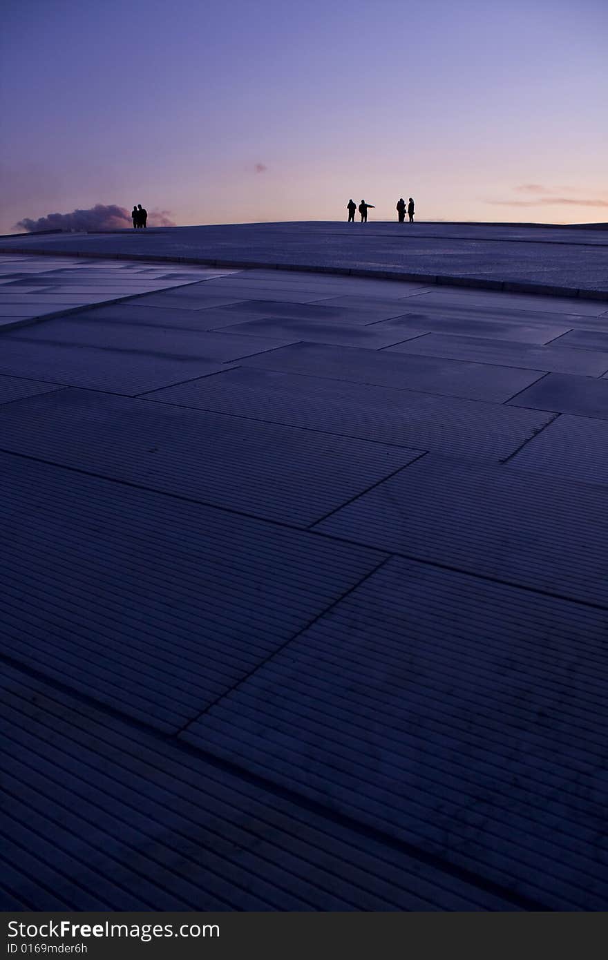 The new opera-builinding in downtown harbour Oslo, Norway. It is possible to walk on the whole roof of the building. Designer is Snohetta. The new opera-builinding in downtown harbour Oslo, Norway. It is possible to walk on the whole roof of the building. Designer is Snohetta.