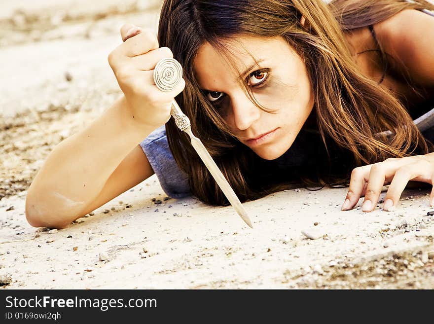 Violent dark woman armed with a knife. Violent dark woman armed with a knife