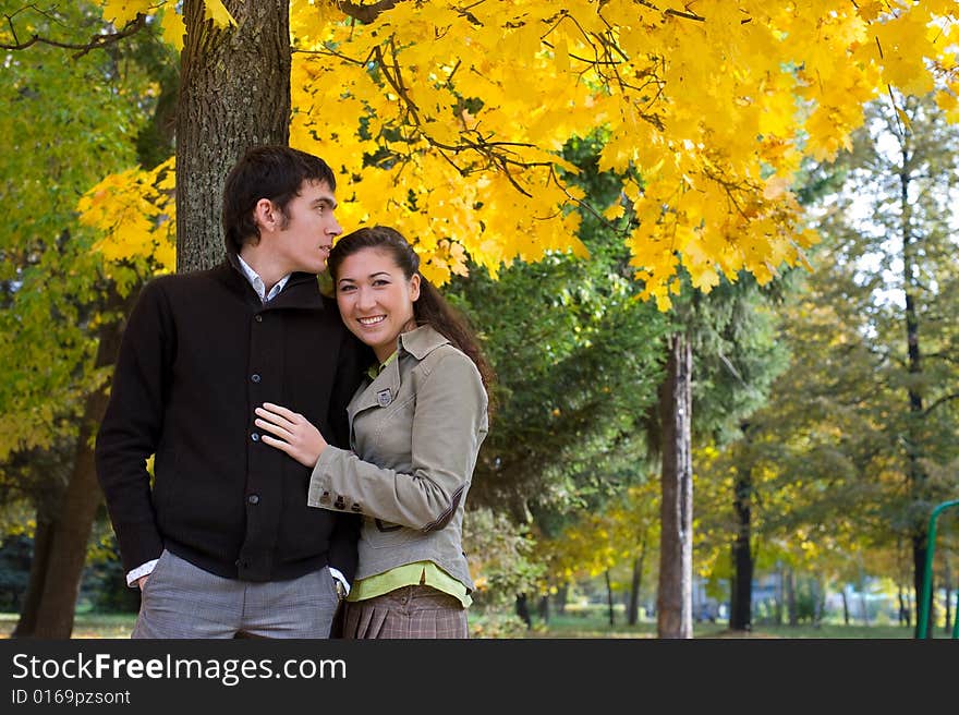 Moment of love. Young beautiful couple have fun In autumn outdoors