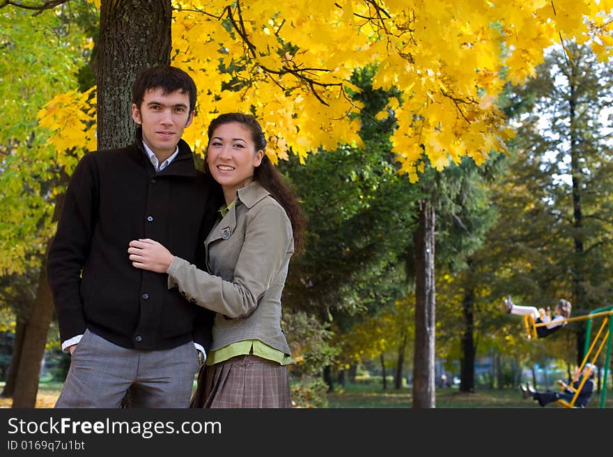 Moment of love. Young beautiful couple have fun In autumn outdoors