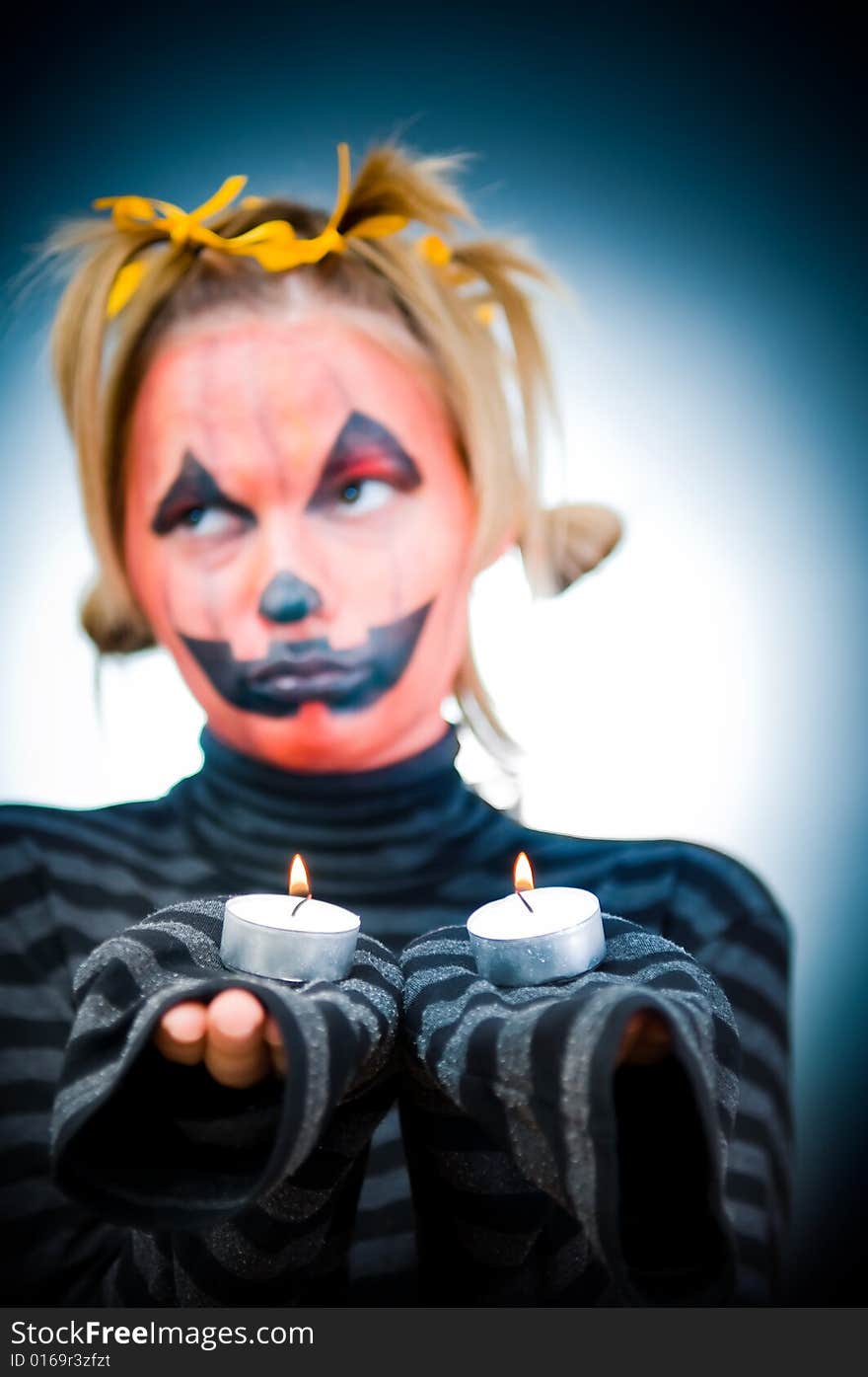 Halloween girl with candles, soft focus