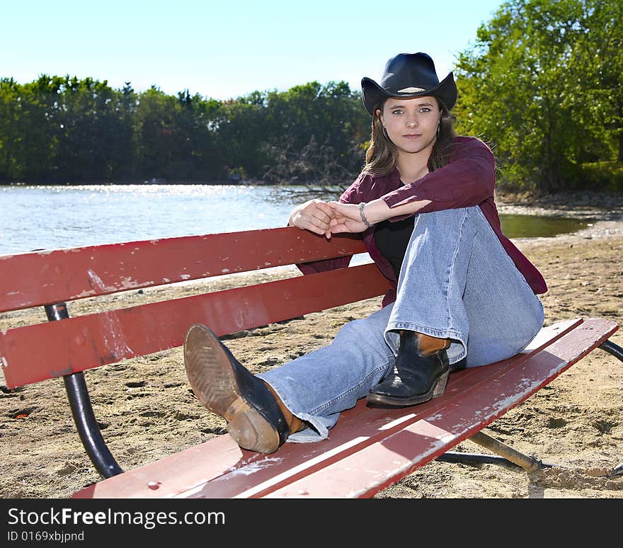 A cowgirl outside on a nice day