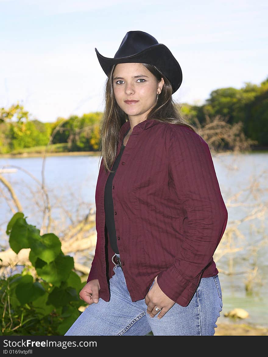 A cowgirl outside on a nice day