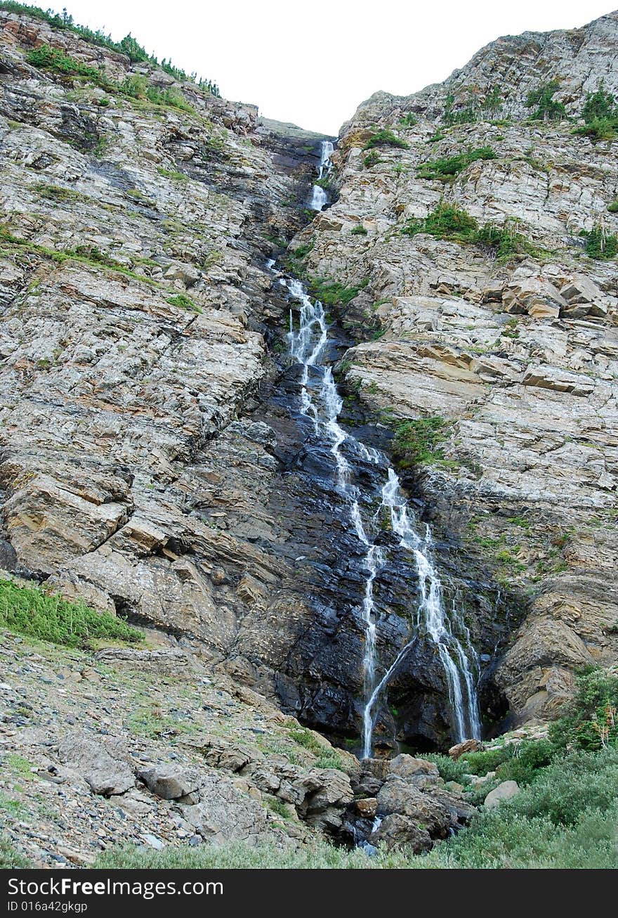 A small waterfall seen from Carthew-Alderson Trail in Waterton National Park Alberta Canada