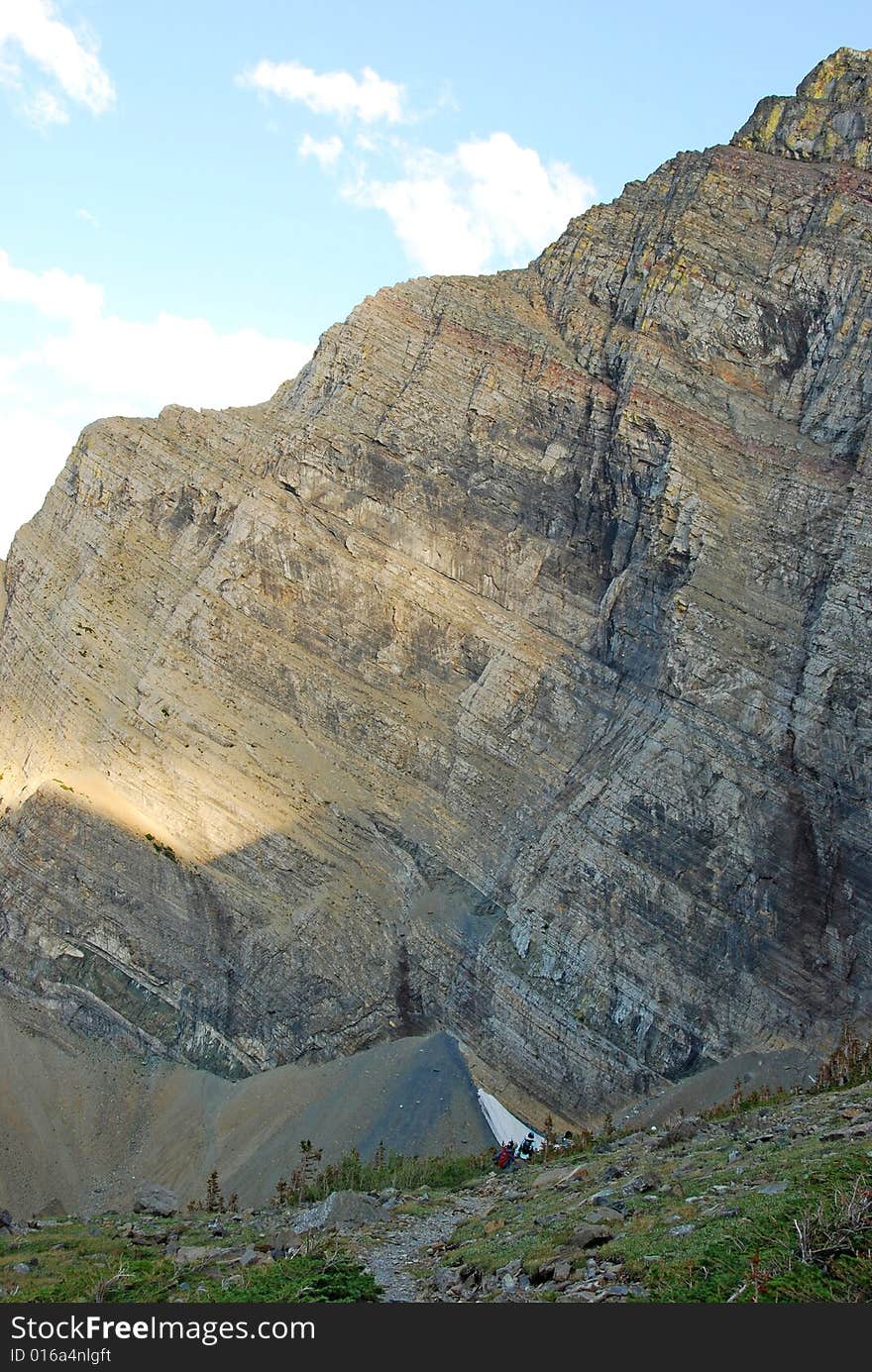 A red color mountain peak on Carthew-Alderson Trail in Waterton National Park Alberta Canada. A red color mountain peak on Carthew-Alderson Trail in Waterton National Park Alberta Canada