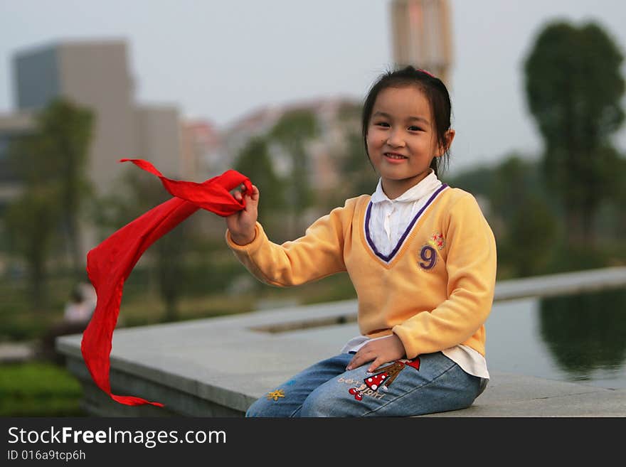 The asian  girl in a park . The asian  girl in a park .