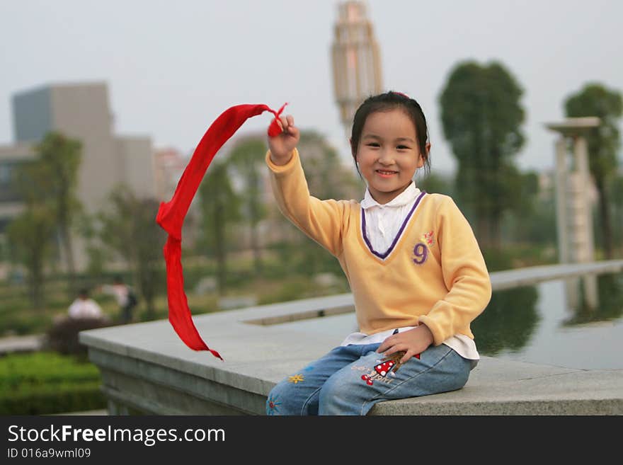 The asian girl in a park . The asian girl in a park .