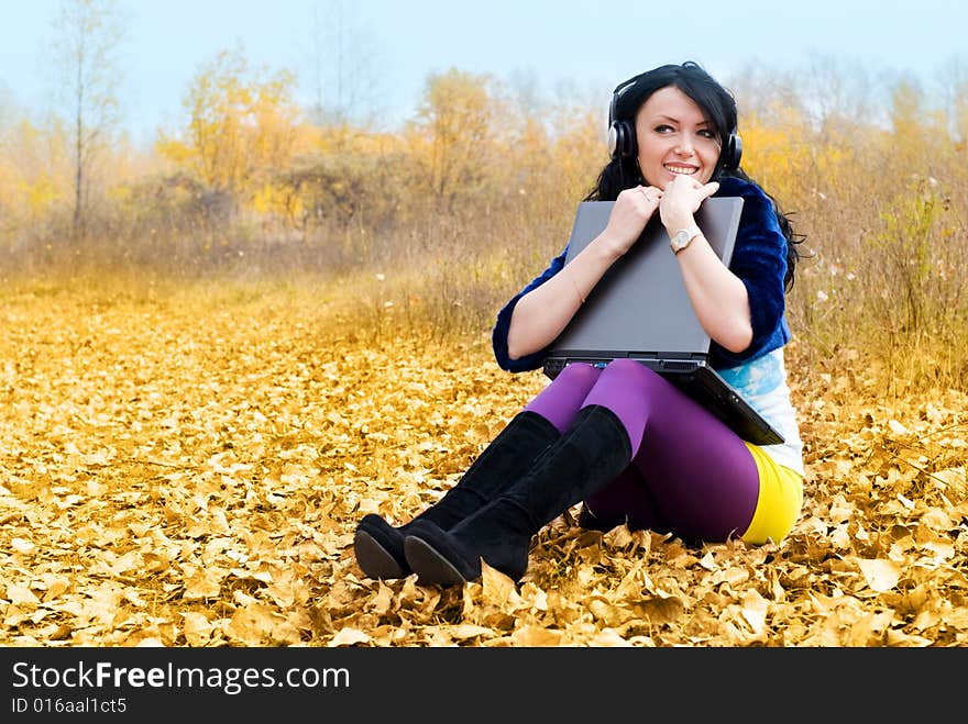 Pretty Girl With A Laptop Outdoor