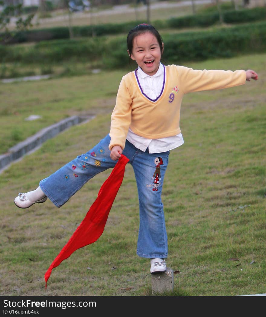 The asian  girl in a park . The asian  girl in a park .