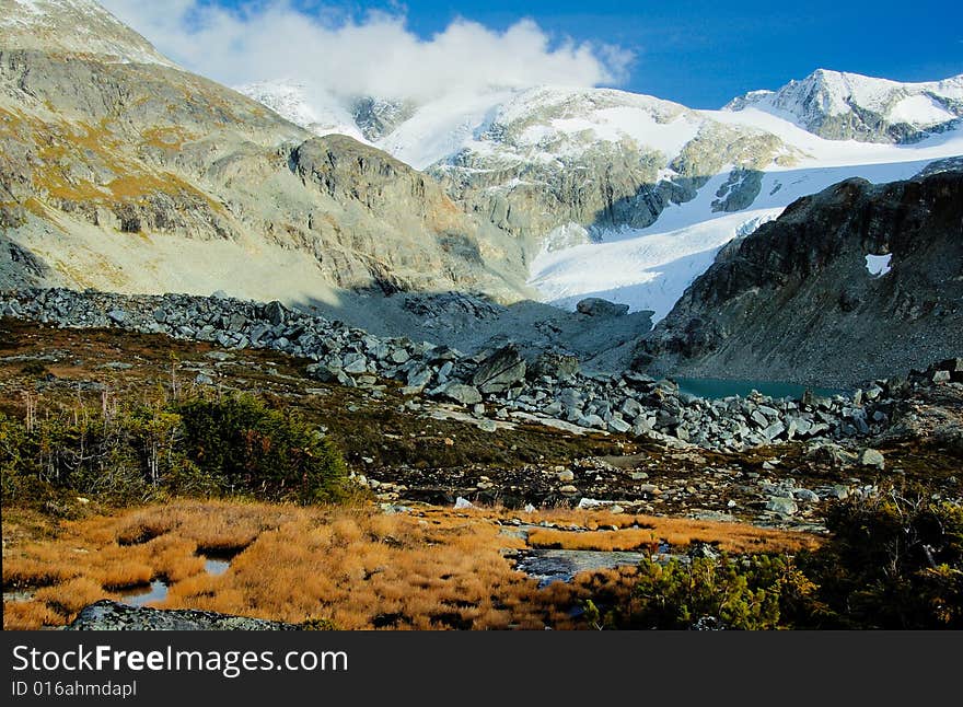 Glacier lake in the mountain in the early fall