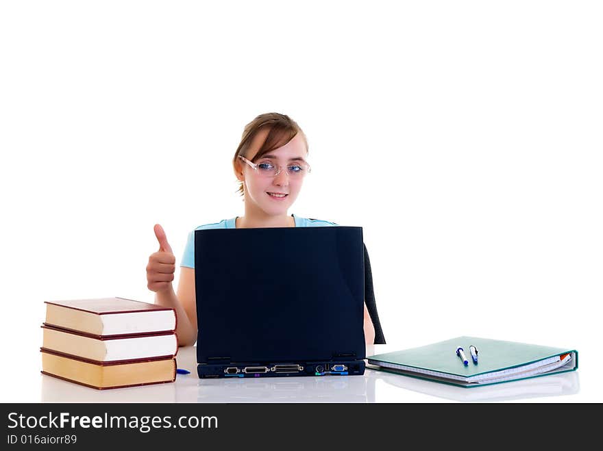 Happy smiling teenager girl on desk doing studying and homework