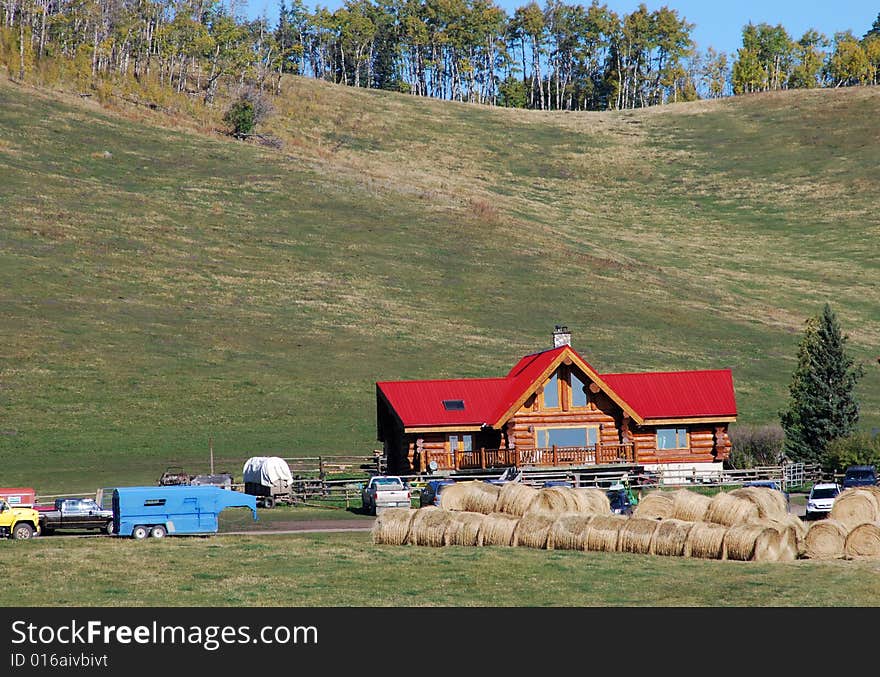 Red roof building on a Canadian farm beside highway