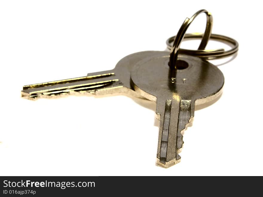 Bounch of keys from steel on a white background. Bounch of keys from steel on a white background