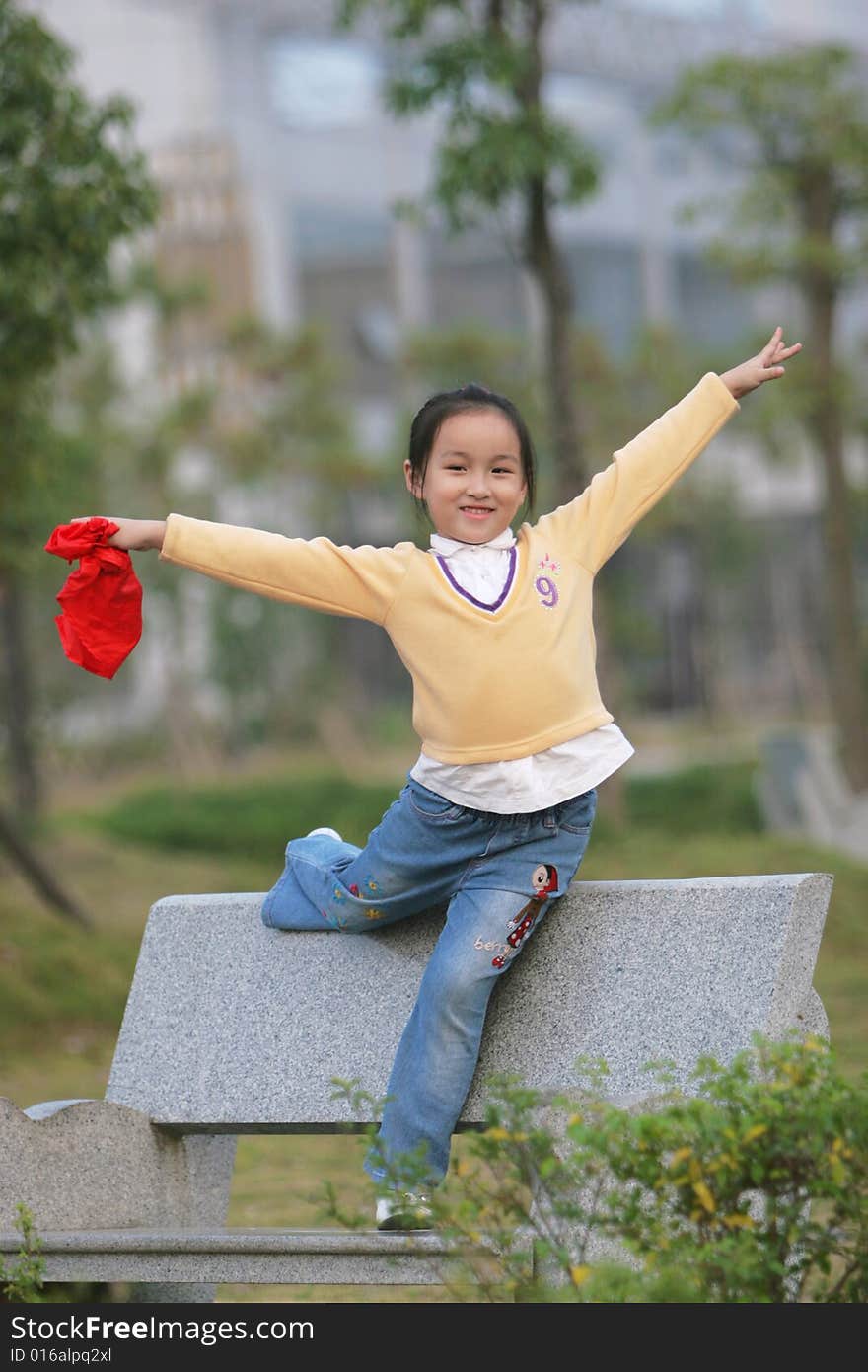 The asian  girl in a park . The asian  girl in a park .