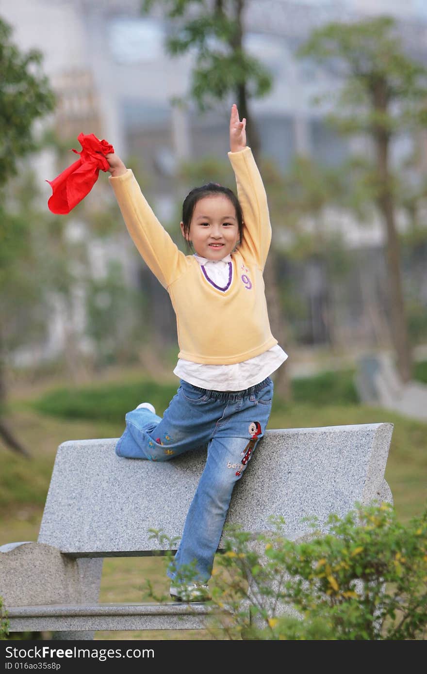 The asian  girl in a park . The asian  girl in a park .